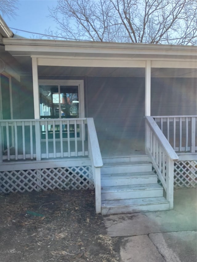 entrance to property with a porch