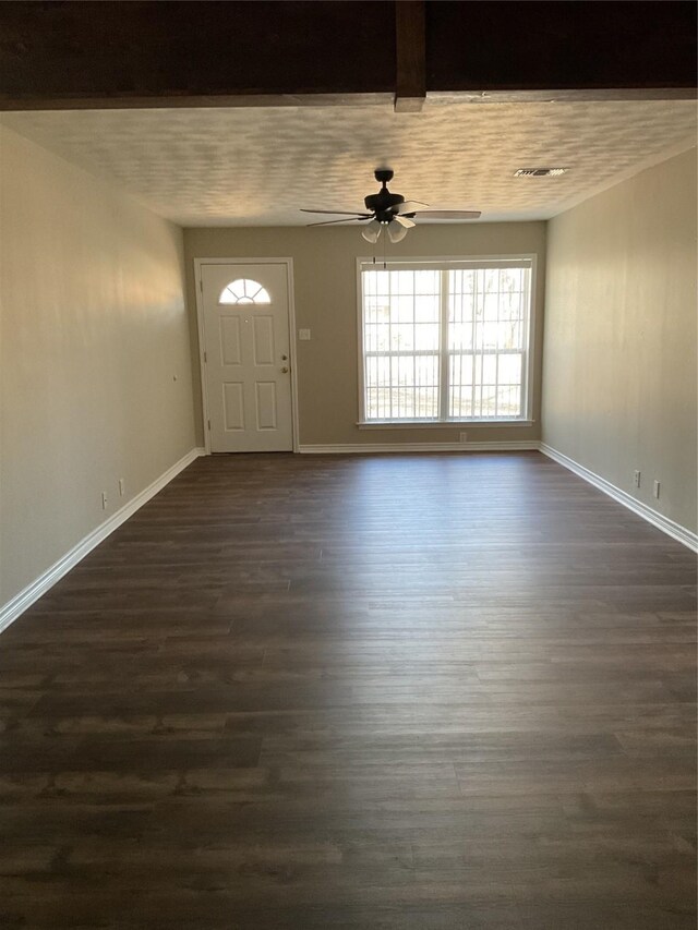 entrance foyer featuring dark wood finished floors, a ceiling fan, and baseboards