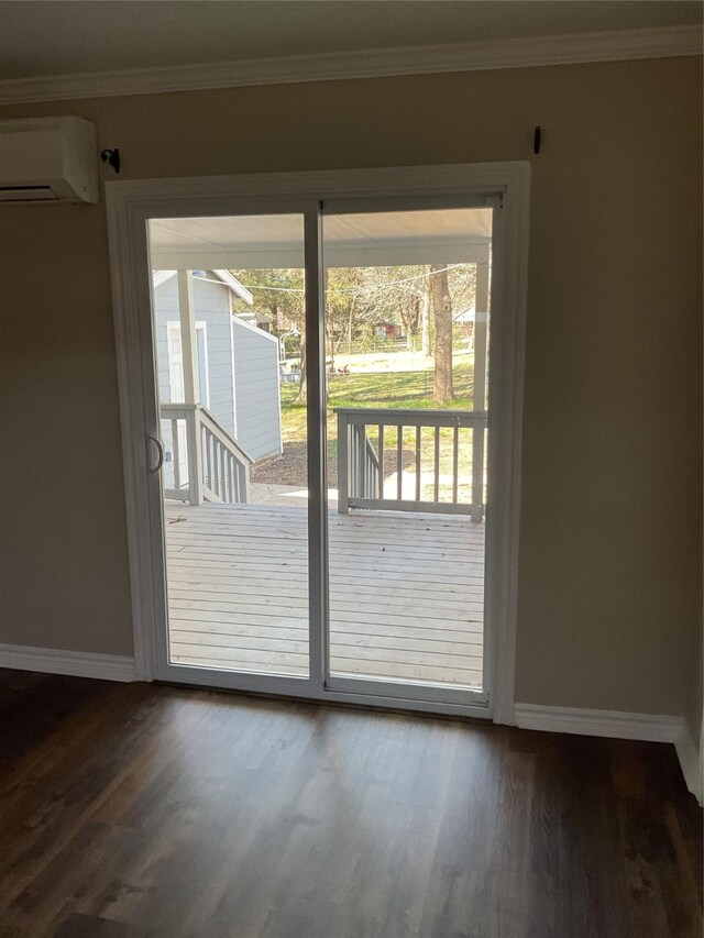 doorway to outside with crown molding, a wall mounted AC, and wood finished floors