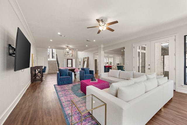 living area with ceiling fan, stairs, ornamental molding, french doors, and wood finished floors