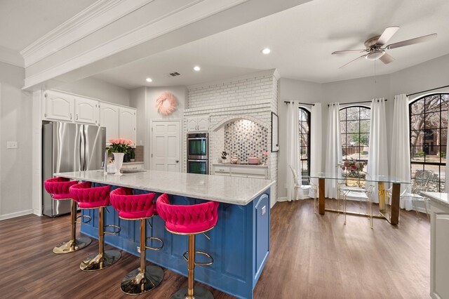 living room featuring recessed lighting, dark wood-style floors, ornamental molding, and a fireplace