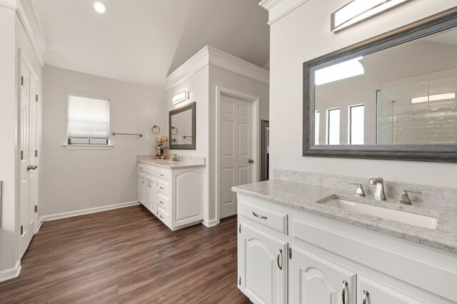 full bathroom with visible vents, a stall shower, wood finished floors, a bath, and vanity