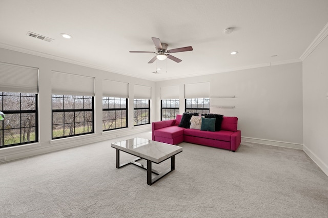 carpeted living area with visible vents, ornamental molding, recessed lighting, baseboards, and ceiling fan