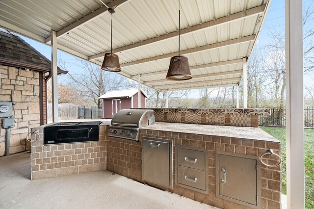 view of patio / terrace featuring fence, area for grilling, an outdoor living space with a fire pit, french doors, and a grill