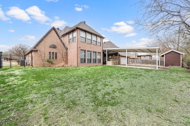 view of patio featuring area for grilling, exterior kitchen, and fence