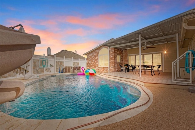 view of pool with a patio area, a fenced in pool, ceiling fan, and fence