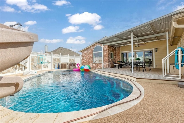 view of pool with a ceiling fan, a patio, fence, and a fenced in pool