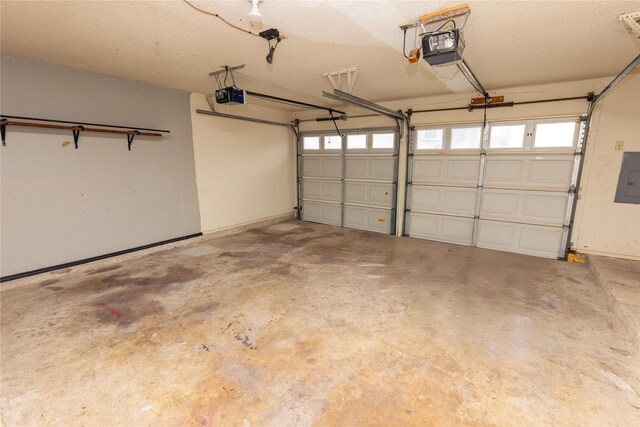 garage with electric panel and a garage door opener