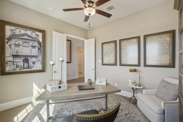 bathroom with vanity, toilet, and baseboards