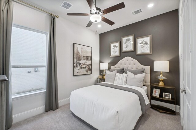 living room featuring carpet floors, ceiling fan, baseboards, and vaulted ceiling