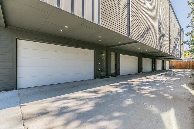 garage with concrete driveway