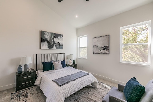 carpeted bedroom featuring recessed lighting, baseboards, multiple windows, and vaulted ceiling