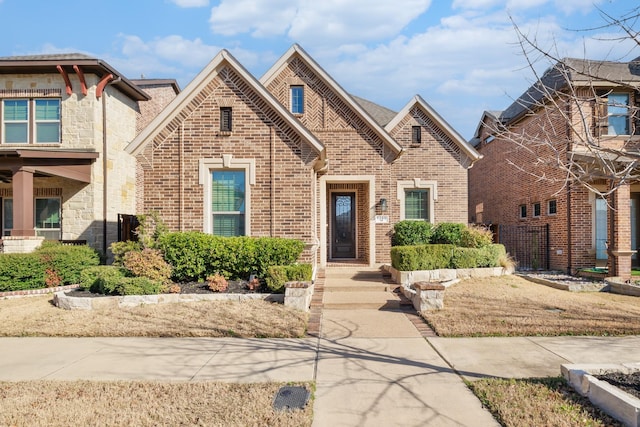 view of front of house with brick siding