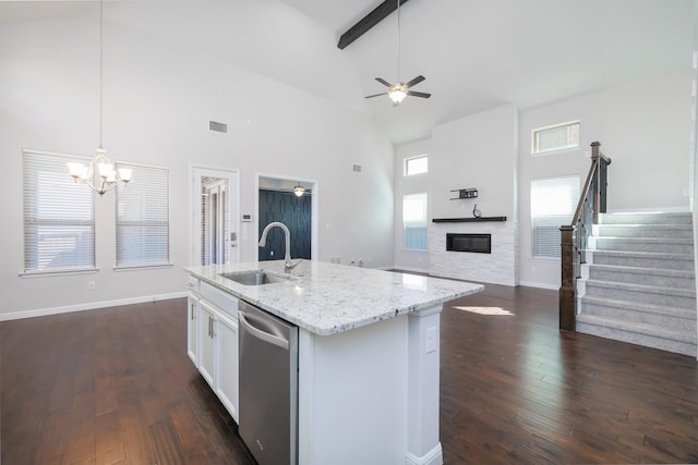 kitchen featuring dishwasher, dark wood-type flooring, visible vents, and a sink