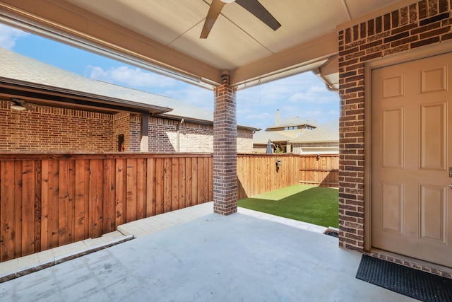 view of patio / terrace with a fenced backyard and ceiling fan