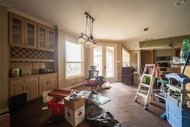 dining area featuring visible vents, indoor bar, baseboards, french doors, and wood finished floors