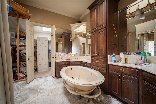 full bathroom with a spacious closet, vanity, crown molding, and a whirlpool tub