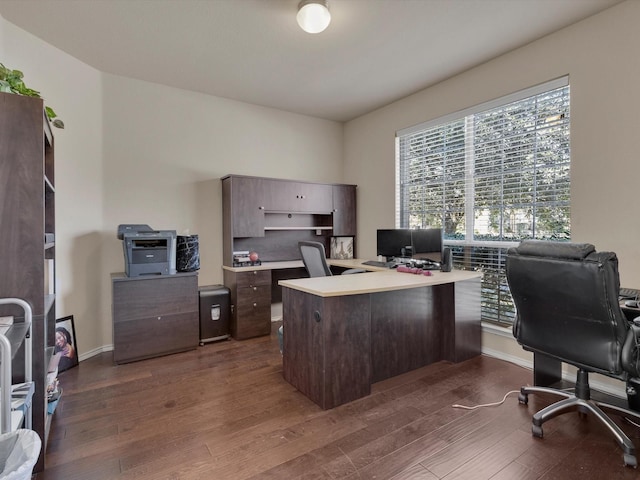 office featuring dark wood-type flooring and baseboards