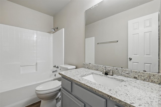 full bath featuring vanity, toilet, and  shower combination