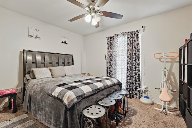 carpeted bedroom with baseboards and a ceiling fan