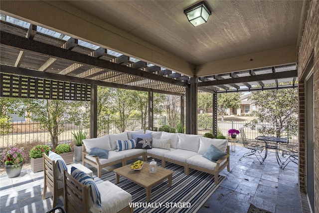 view of patio with outdoor lounge area, fence, and a pergola