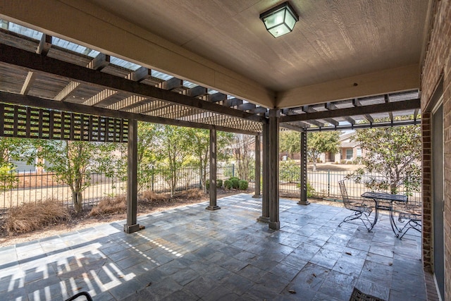 view of patio / terrace featuring a pergola and fence