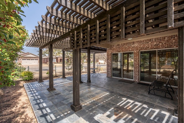 view of patio / terrace with a pergola and fence