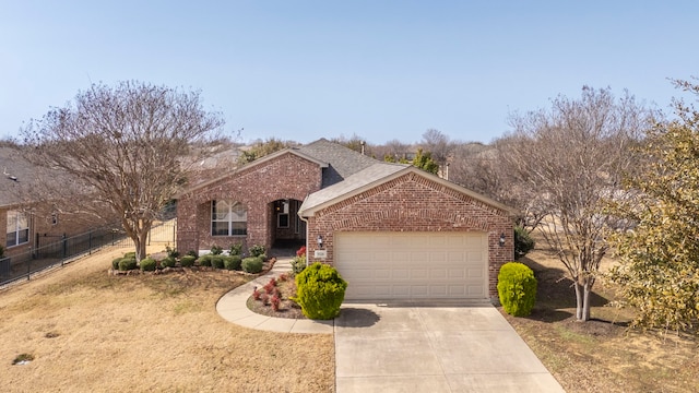 single story home featuring brick siding, fence, concrete driveway, roof with shingles, and a garage