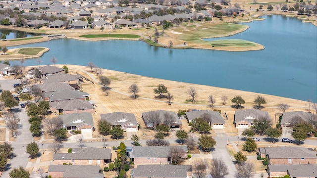 drone / aerial view with a residential view and a water view