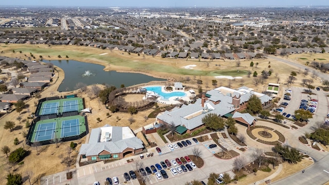 aerial view featuring a residential view, a water view, and view of golf course