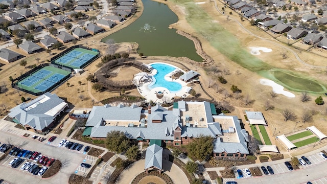 bird's eye view featuring a water view and a residential view