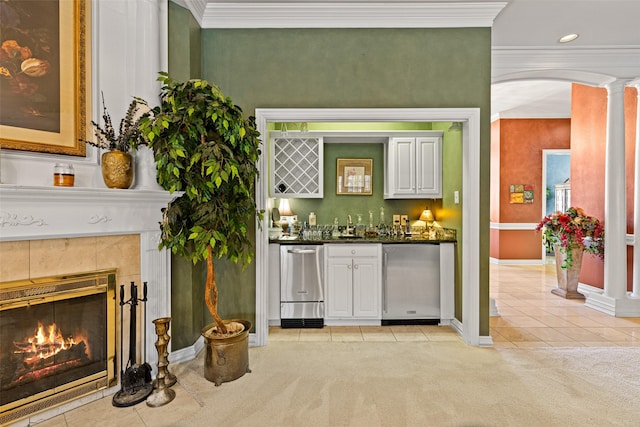 bar featuring arched walkways, light colored carpet, and dishwasher