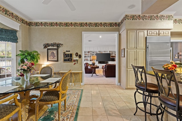 dining area with light tile patterned floors, ceiling fan, and ornamental molding