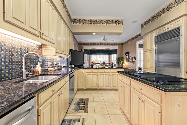 kitchen with ornamental molding, a sink, stainless steel appliances, a peninsula, and light tile patterned floors