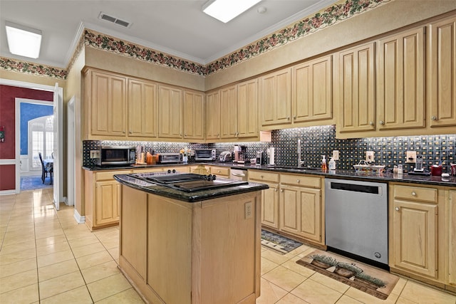 kitchen with visible vents, light brown cabinetry, a sink, dark countertops, and appliances with stainless steel finishes