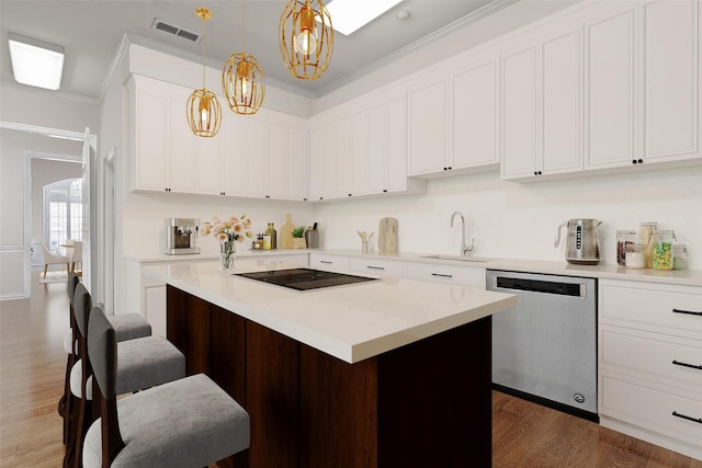 kitchen with visible vents, stainless steel dishwasher, wood finished floors, black electric cooktop, and a sink