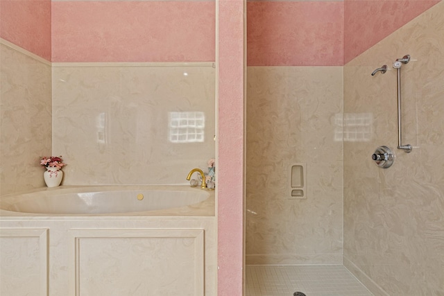 full bathroom featuring a garden tub and a stall shower