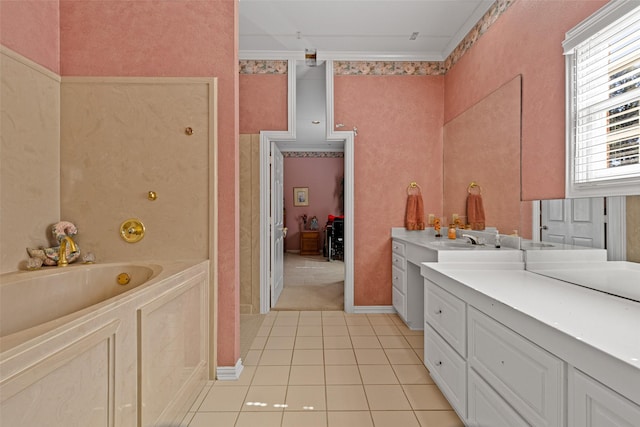 bathroom with vanity, baseboards, tile patterned flooring, crown molding, and a garden tub