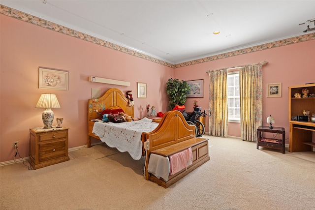 bedroom featuring carpet and baseboards