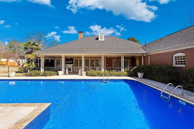 view of pool featuring a fenced in pool, a patio area, and fence