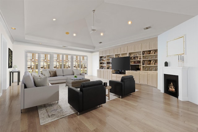 living room with visible vents, built in shelves, a warm lit fireplace, recessed lighting, and light wood finished floors