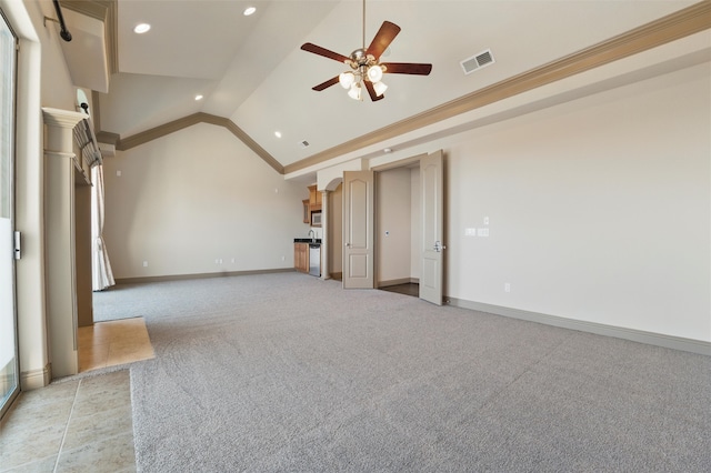 unfurnished living room with visible vents, baseboards, lofted ceiling, crown molding, and light colored carpet