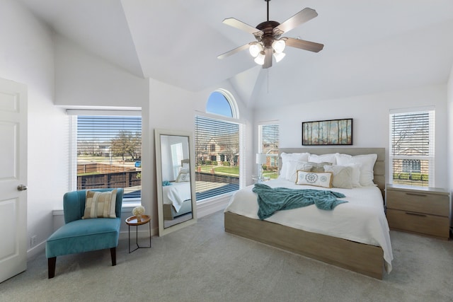 bedroom with ceiling fan, carpet flooring, and high vaulted ceiling