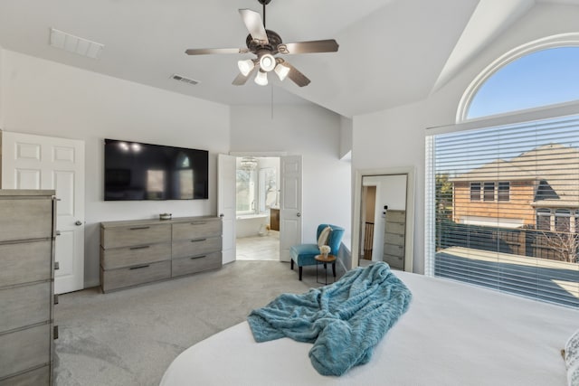 bedroom featuring light carpet, visible vents, and multiple windows