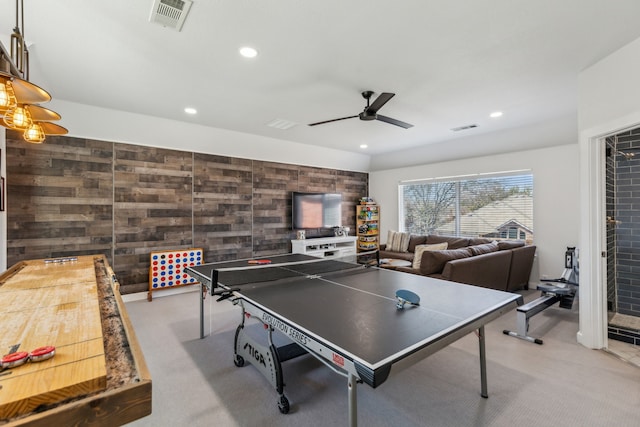 playroom with visible vents, recessed lighting, wood walls, and a ceiling fan