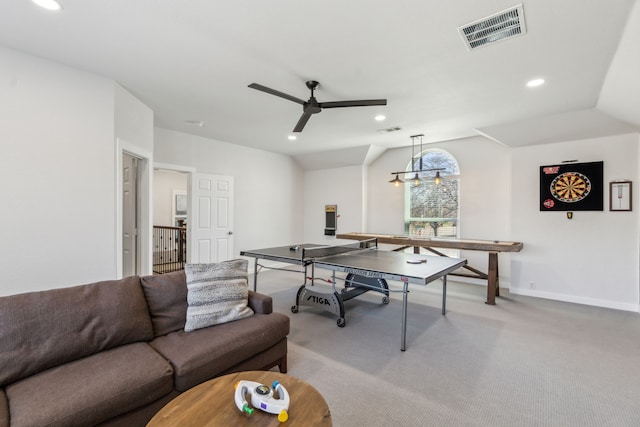 recreation room featuring a ceiling fan, visible vents, lofted ceiling, recessed lighting, and light colored carpet