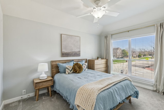 carpeted bedroom featuring baseboards, ceiling fan, and vaulted ceiling