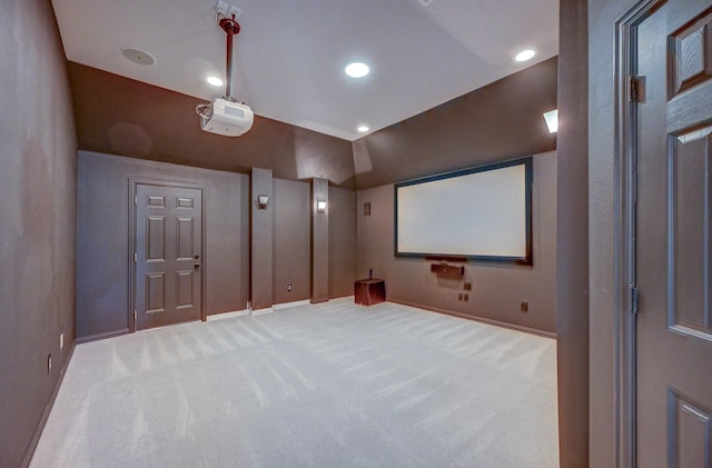 home theater room featuring recessed lighting, baseboards, and light colored carpet