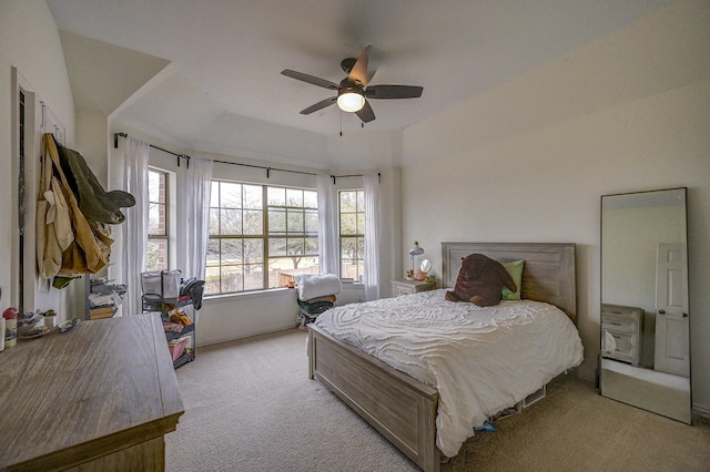 bedroom featuring light colored carpet and ceiling fan