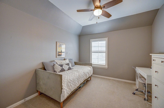 bedroom featuring baseboards, lofted ceiling, light colored carpet, and ceiling fan